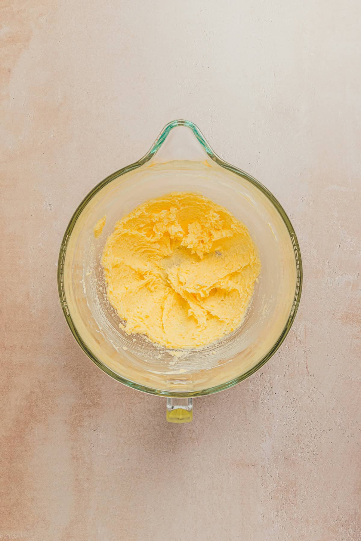 Lemon cookie dough mixture after adding butter.
