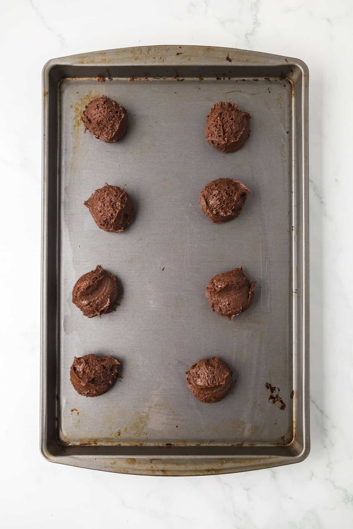 brownie-cookie-dough-scooped-baking-sheet