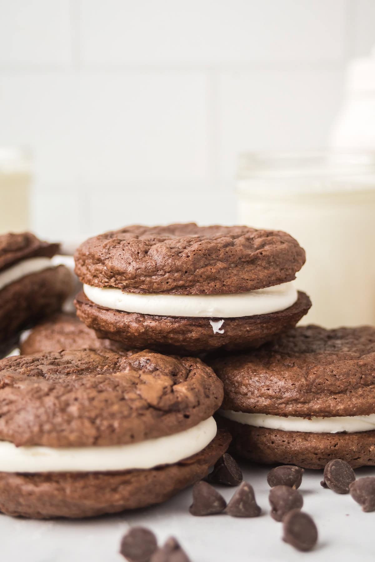 Stack of homemade brownie cream pies with soft cookies and creamy filling.