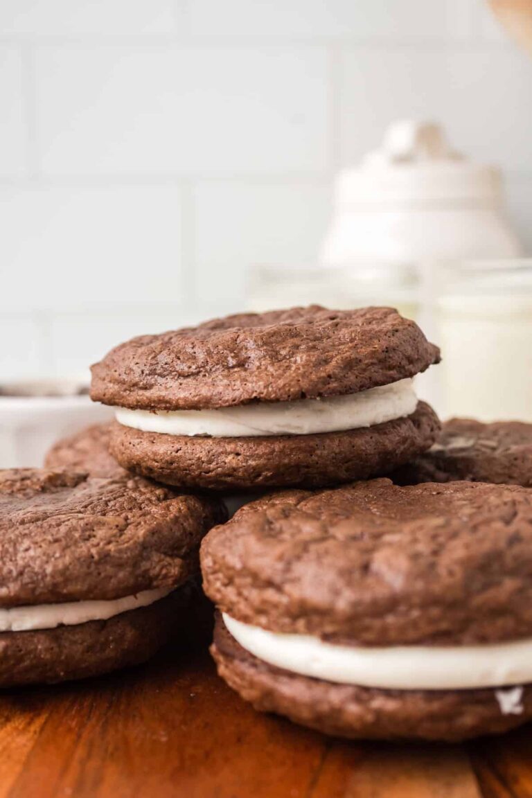 Homemade brownie cream pies stacked with creamy filling in between.