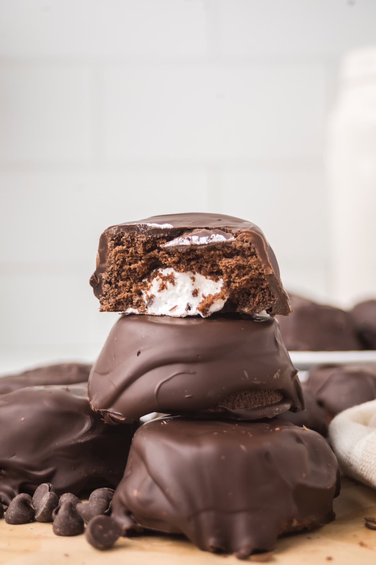 Homemade Ding Dong cut open showing fluffy cream filling inside chocolate cake layers.