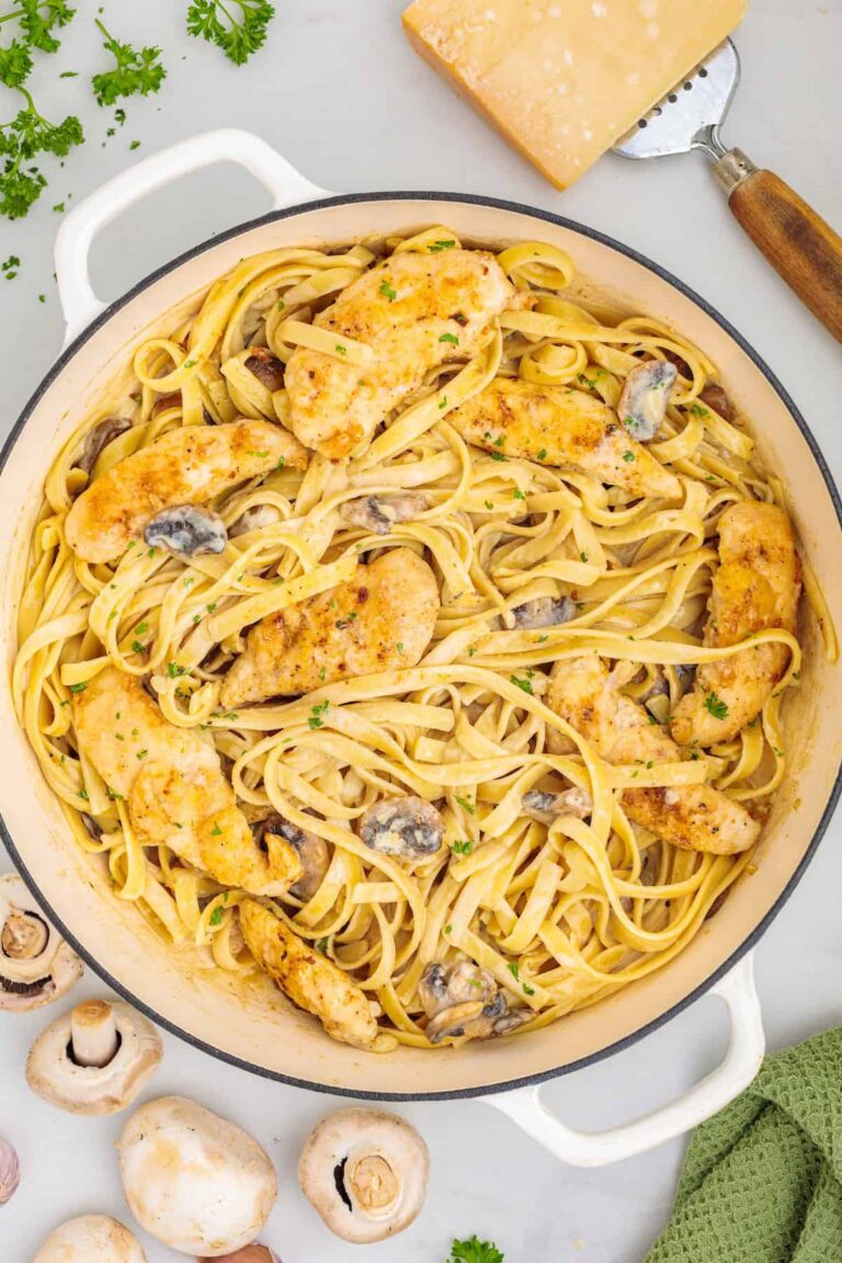 Creamy chicken Marsala fettuccine with golden chicken, mushrooms, Parmesan cheese, and fresh parsley in a rich Marsala cream sauce.