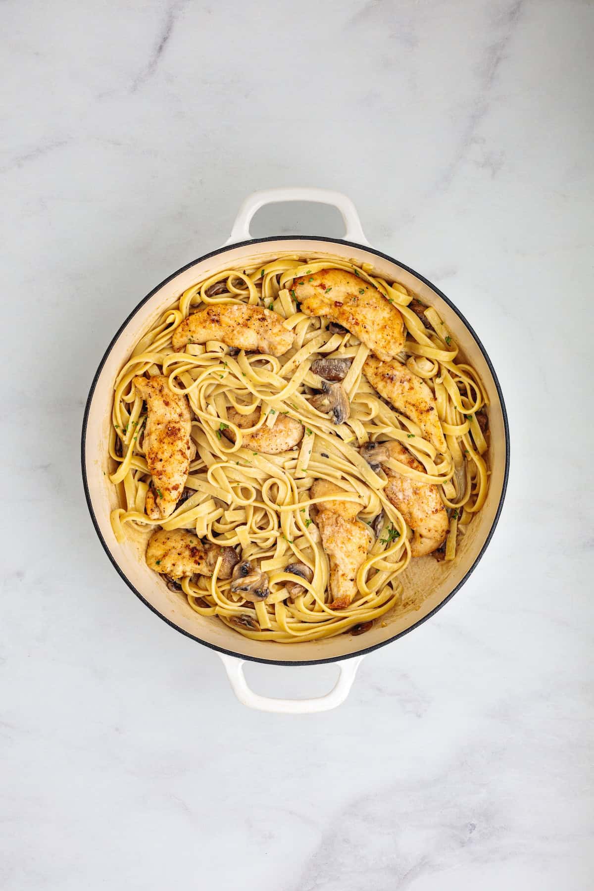 Creamy chicken Marsala fettuccine with golden pan-seared chicken, mushrooms, and a rich Parmesan Marsala sauce.